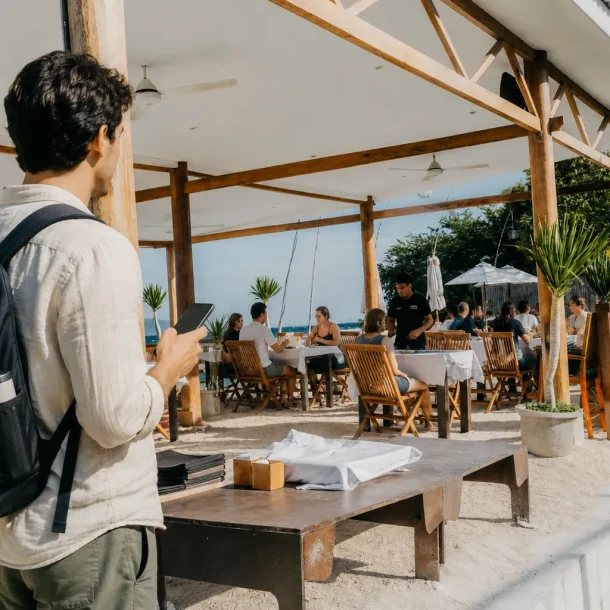 Traveler in front of Kokomo restaurant beachfront
