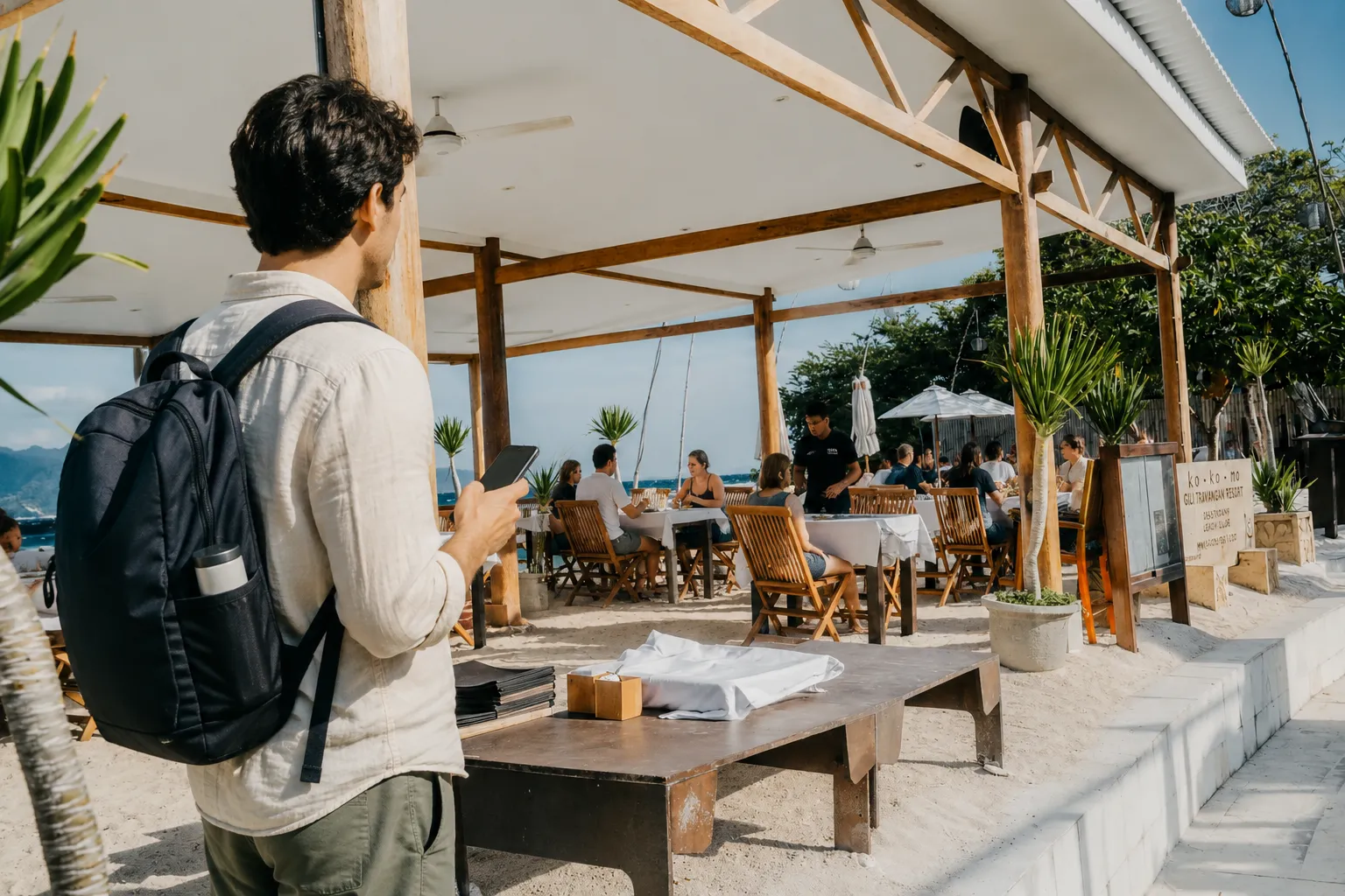 Traveler in front of Kokomo restaurant beachfront